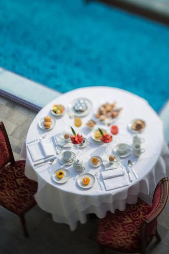 a white table with eggs and food on it at Grand Hotel Trieste & Victoria in Abano Terme