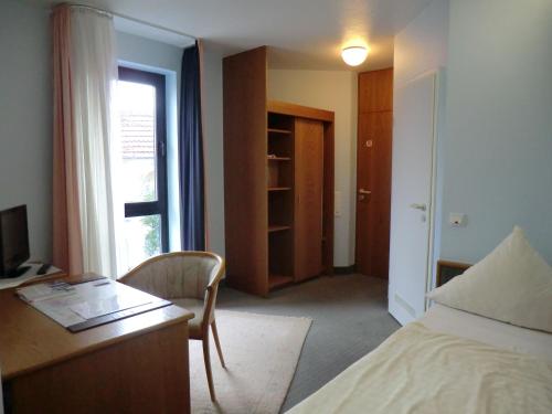 Postel nebo postele na pokoji v ubytování Hotel Corsten