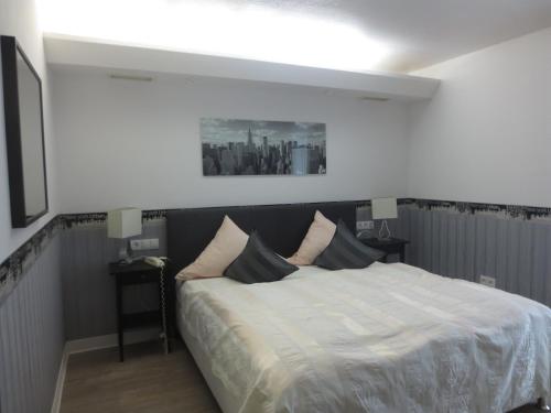Postel nebo postele na pokoji v ubytování Hotel Corsten
