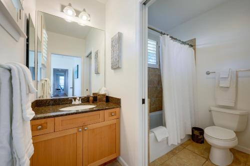 a bathroom with a sink and a toilet and a shower at Hale Terra 3br 2ba Beautiful Nihilani Condo, Central AC, Pool, Hot Tub in Princeville