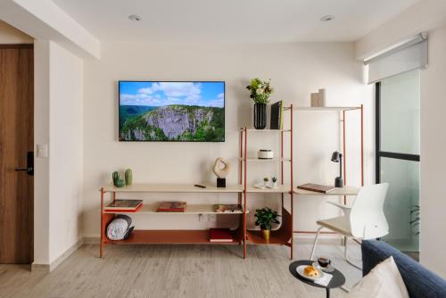 a living room with a desk and a couch at Choapan 28 - Lux Apartments in Condesa in Mexico City