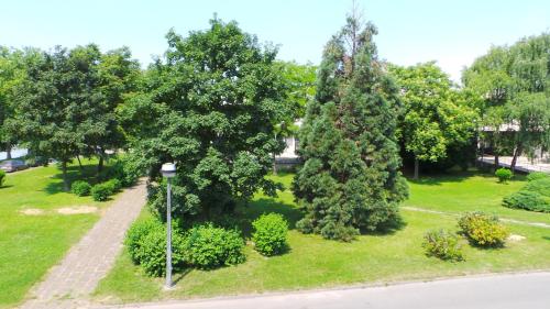 an overhead view of a park with trees and a street light at Hostel Levicki in Slavonski Brod