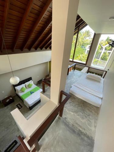 Ένα ή περισσότερα κρεβάτια σε δωμάτιο στο Nirmala Villa