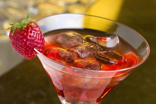 a cup of tea with a strawberry in it at Grand Hotel Trieste & Victoria in Abano Terme