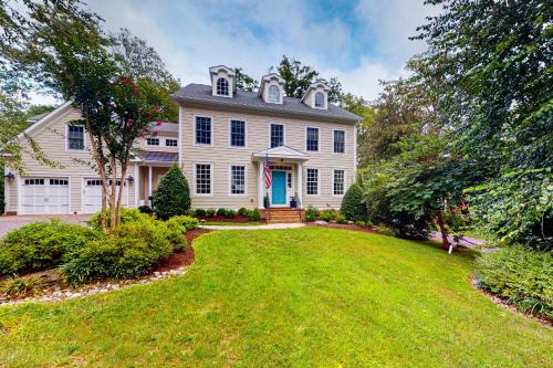 a large white house with a yard at Ensign's Ridge in Annapolis