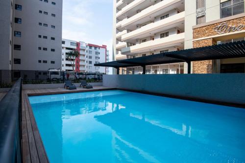 a swimming pool in the middle of a building at Luxury Bellagio 302 with Sea Views and Inverter in Durban