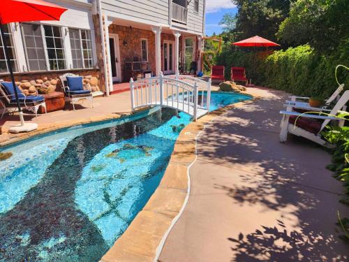 a swimming pool in front of a house at Oak Hill Inn in Julian