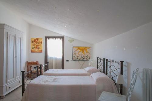 Postel nebo postele na pokoji v ubytování B&B Le Fresie