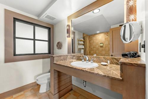 a bathroom with a sink and a toilet at Sun Mountain Lodge in Winthrop