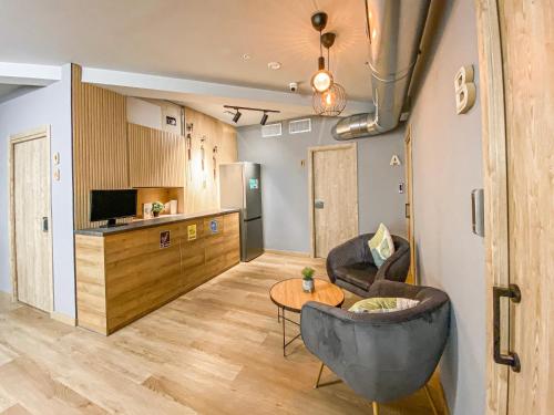 a living room with a couch and a table at The POD Suite Hostel in Valencia