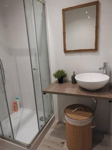 a bathroom with a sink and a shower at Seacastle Residence Peniche in Atouguia da Baleia