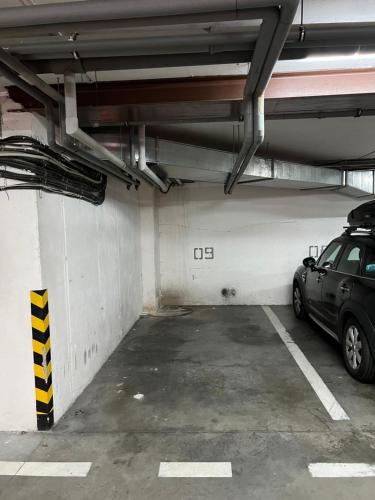 a parking garage with a car parked in it at Castle View Apartment with free parking in Bratislava