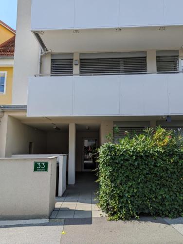 a building with a sign in front of it at Lend City Apartment self-check-in in Graz