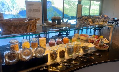 a display of jars of food on a table at B&B Hotel Mattli Übernachtung Frühstück in Morschach