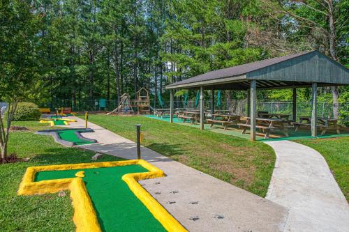 a park with a playground with a slide and a table at Tranquil Paradise in Ellijay