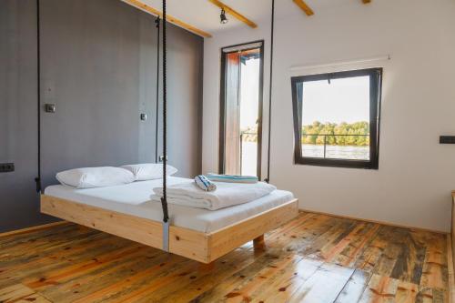 a bed with a swing in a room at ArkaBarka 2- Floating Dream Rooms and Apartments in Belgrade