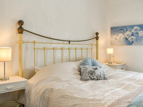 Postel nebo postele na pokoji v ubytování Bathurst Cottage