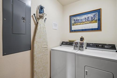 a laundry room with a washer and dryer at Good Medicine Lodge in Whitefish