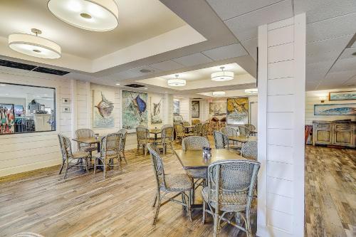 a restaurant with tables and chairs in a room at Golf Course Living at Palmilla Beach in Port Aransas