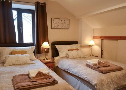 מיטה או מיטות בחדר ב-Tan-y-fron Holiday Park