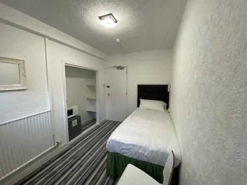 Postel nebo postele na pokoji v ubytování Aaran Central Guesthouse
