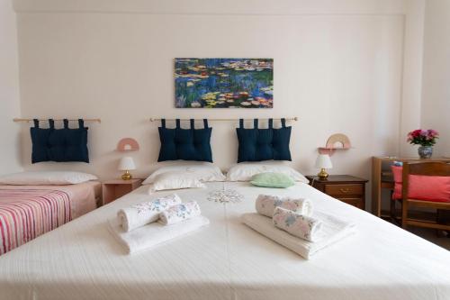 a bedroom with a large white bed with towels on it at Soggiorno in Valdelsa in Poggibonsi