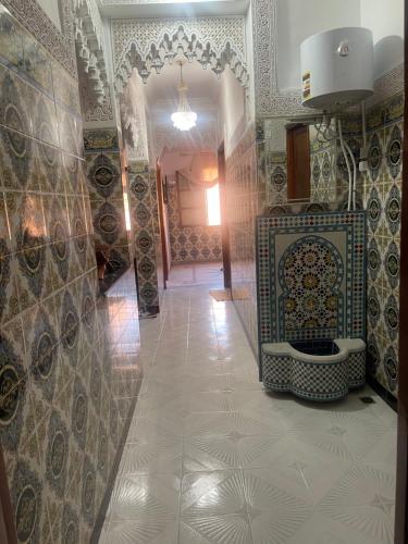 a hallway with a bathroom with a toilet in it at Appartement near to AirPort 262 avenue el khalij in Marrakesh
