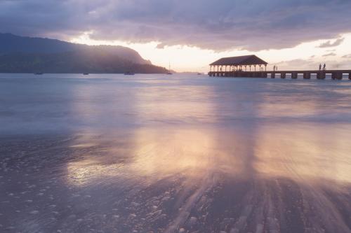 a view of the water with a pier and the sky at Princeville Condo with AC, Pool, Garage, Beach Gear 27B in Princeville