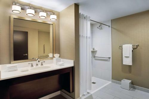 a bathroom with a sink and a shower at Hilton Chicago in Chicago
