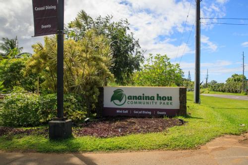 a sign for ananta flow community park next to a street at Princeville Condo with AC, Pool, Garage, Beach Gear 27B in Princeville