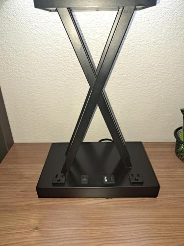 a black router sitting on top of a wooden table at Days Inn & Suites by Wyndham Rocky Mount Golden East in Rocky Mount