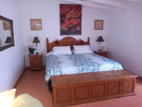 a bedroom with a large bed and two night stands at Rosarito #12 beach front in Rosarito