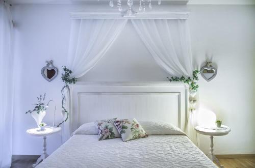 Ένα ή περισσότερα κρεβάτια σε δωμάτιο στο B&B Il Cuore