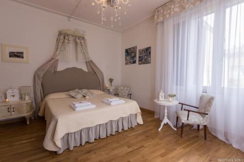 Ένα ή περισσότερα κρεβάτια σε δωμάτιο στο B&B Il Cuore