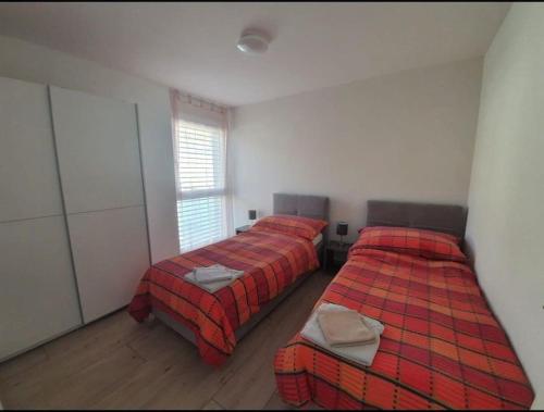 Postel nebo postele na pokoji v ubytování Jacqueline residence