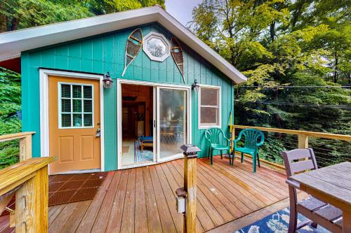 a small shed with a table and chairs on a deck at Beebe Pond Paradise in Castleton
