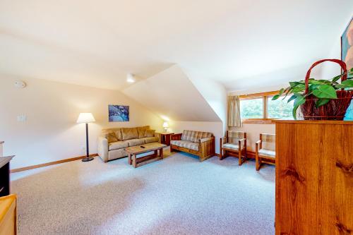 a living room with a couch and a table at Trail Creek 42 in Killington