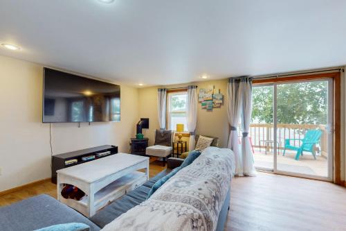 a living room with a couch and a table at Tranquil Seclusion in Augusta