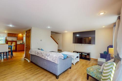 a living room with a couch and a table at Tranquil Seclusion in Augusta