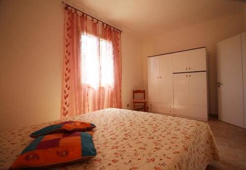 Ένα ή περισσότερα κρεβάτια σε δωμάτιο στο Casa Vacanze Rosita by LoveSud