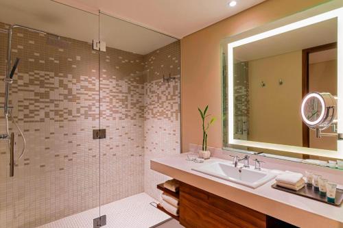 a bathroom with a sink and a shower at The Westin Cozumel in Cozumel