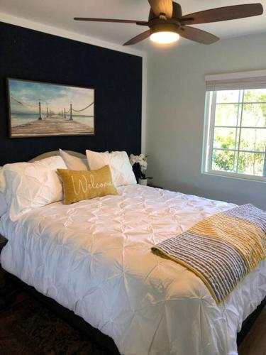 a bedroom with a bed with a ceiling fan at Santa Barbara Serenity Large 1-bedroom Guest Apt. in Santa Barbara