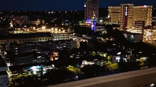 a view of the city at night at SLEPTOPIA Premium Unit with Twin Queen Bed in Nagoya