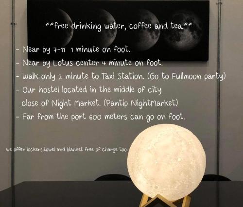 a sign in a museum with a moon on display at Prachan Hostel in Thongsala