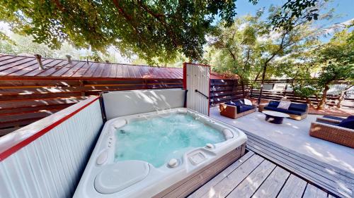 a hot tub sitting on top of a deck at Moab Flats #7 in Moab