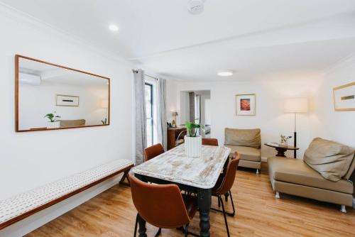 a living room with a table and a couch at 'The Fleetwood' Best Local Experience for Couples in Mudgee