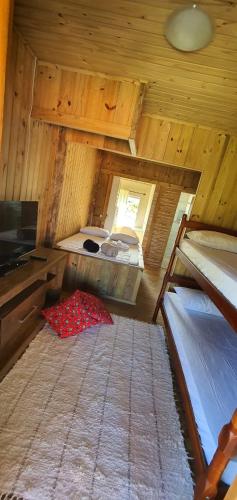 an overhead view of a room with two bunk beds at Pousada Campus Rosa in Praia do Rosa