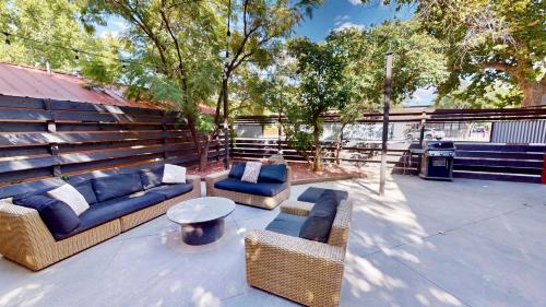 a patio with couches and chairs and a table at Moab Flats #2 in Moab