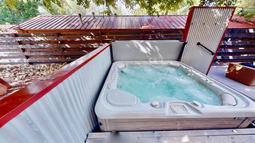 a hot tub sitting on top of a deck at Moab Flats #2 in Moab