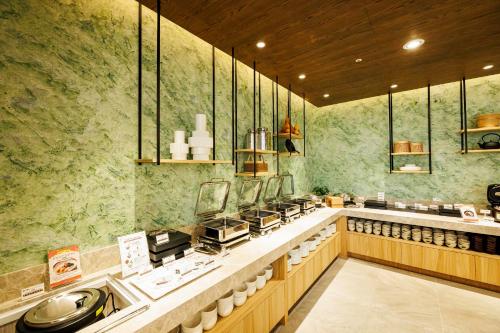 a restaurant with aasteryasteryasteryasteryasteryasteryasteryasteryasteryasteryasteryastery at Solaria Nishitetsu Hotel Taipei Ximen in Taipei